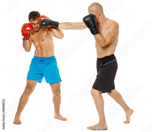 Kickboxers sparring on white