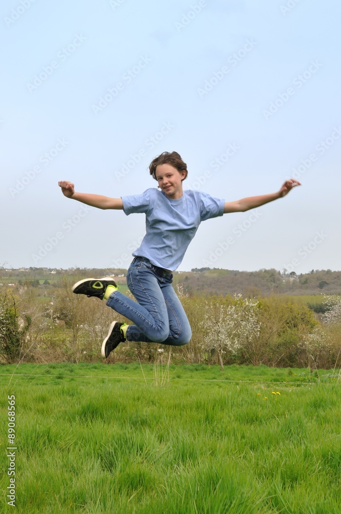 Girl jumping in a garden