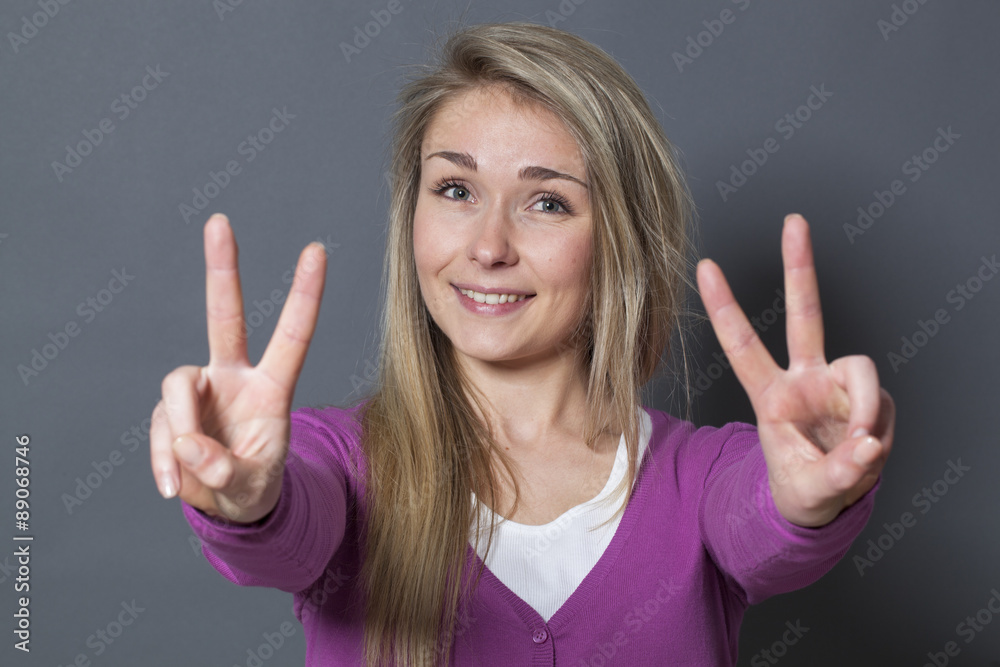 happy 20s woman showing 2 victory signs foreground happy 20s woman showing 2 victory signs foreground