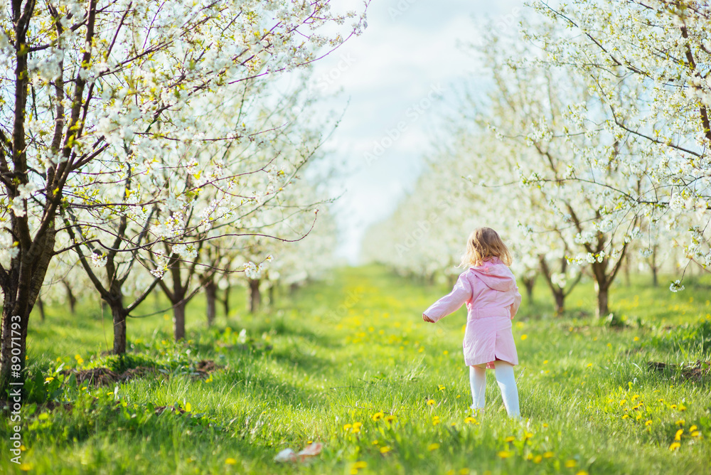 child outdoors in the blossom trees. Art processing and retouchi child outdoors in the blossom trees. Art processing and retouchi