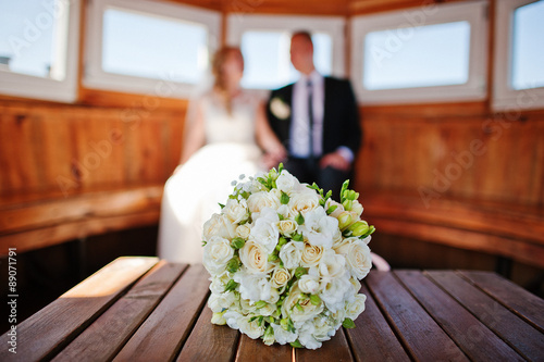 wedding couple on a ship cabin photo