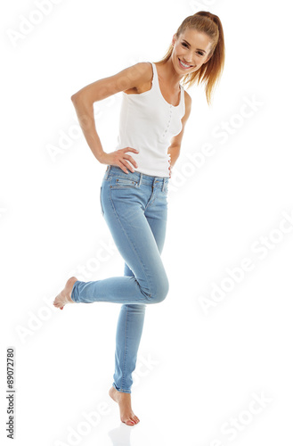 Young girl in jeans and a white t-shirt