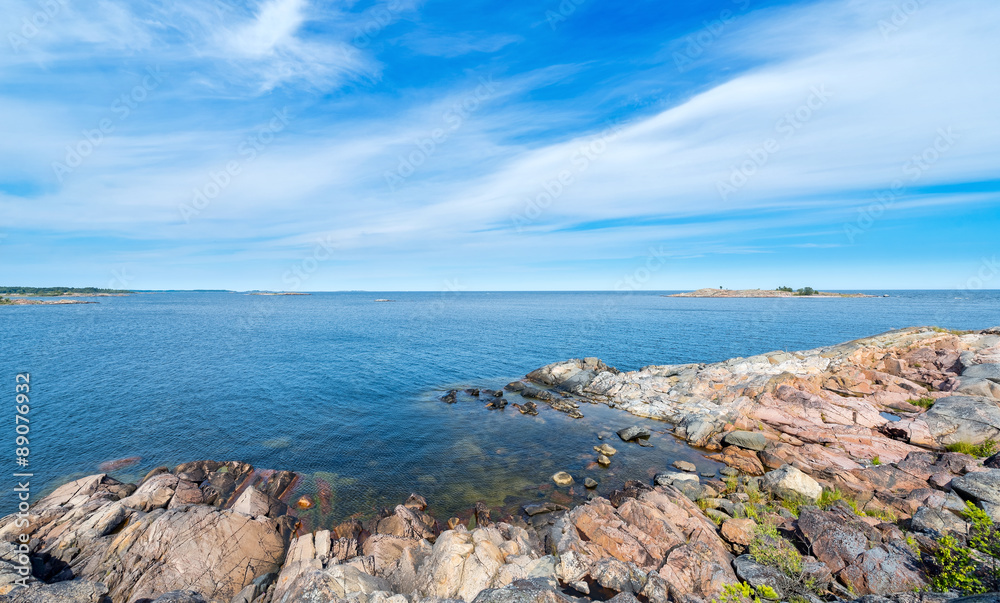 Rocky coastline in vivid colors during a beautiful summer day Rocky coastline in vivid colors during a beautiful summer day