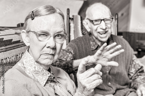 Toned Image of Angry Old Couple in Livingroom