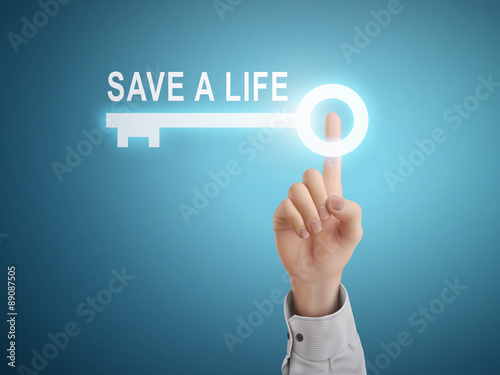 male hand pressing save a life key button