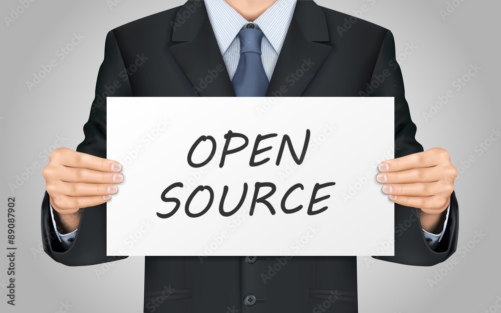businessman holding open source poster businessman holding open source poster