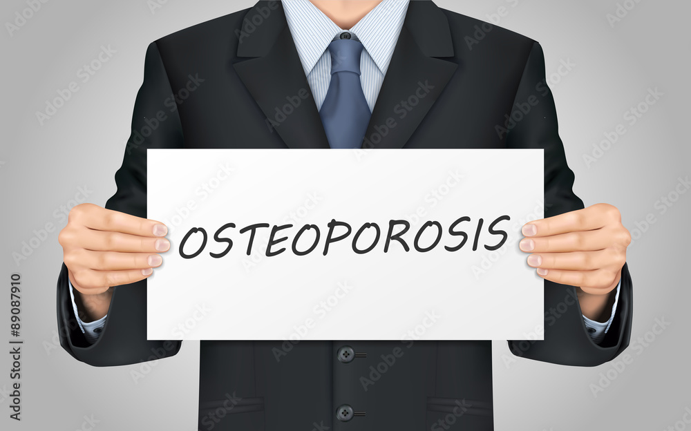 businessman holding osteoporosis poster businessman holding osteoporosis poster