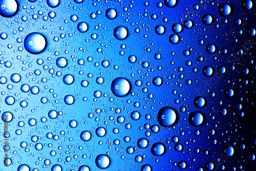 Water drops closeup. Abstract blue background of waterdrops