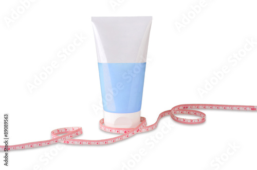cosmetics container with rolled centimeter isolated on white background