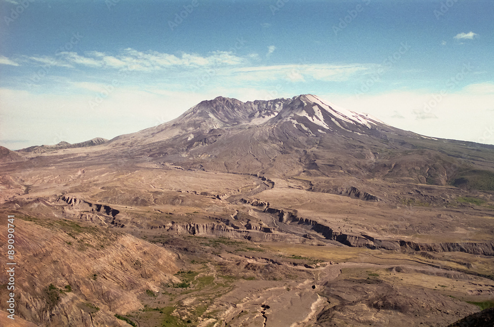 Mount Saint Helens in 1997 - Mt. St. Helens lit by setting sun in the evening. The volcano, crater, dome and lava flow (post May 18, 1980 eruption) can be seen. Grainy photo shot in July 1997 on film. Mount Saint Helens in 1997 - Mt. St. Helens lit by setting sun in the evening. The volcano, crater, dome and lava flow (post May 18, 1980 eruption) can be seen. Grainy photo shot in July 1997 on film.