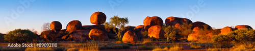 Devil's Marbles, Australia. The Devils Marbles are an extensive collection of red granite boulders in the Tennant Creek area of Australia's Northern Territory