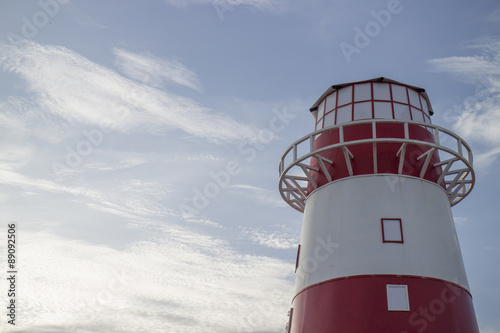 red and white light house photo