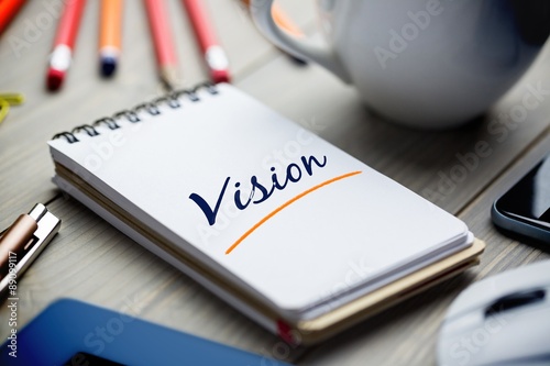 Vision against notepad on desk