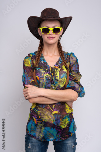 woman wearing sunglasses and cowboy hat