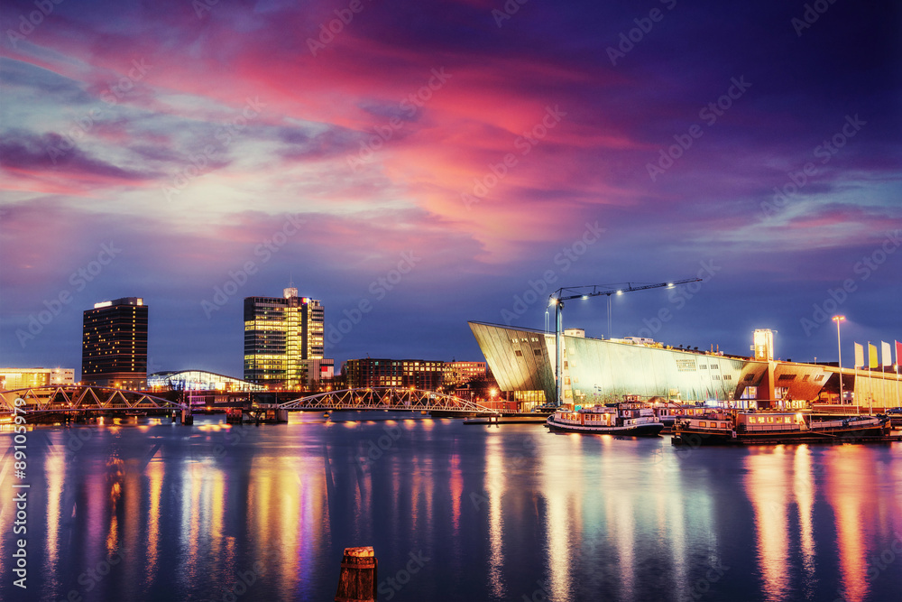 Fototapeta premium Beautiful night in Amsterdam. Night illumination of buildings an