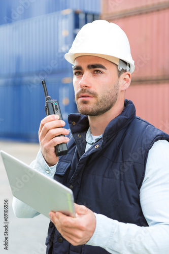 Photography Young Attractive docker using tablet at work