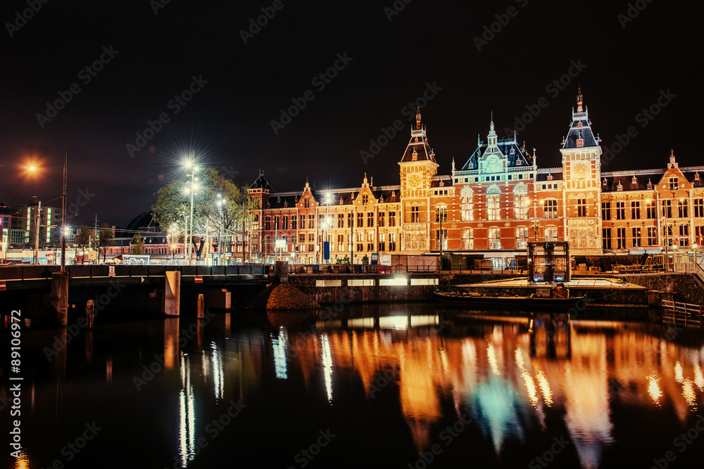 Beautiful night in Amsterdam. Night illumination of buildings an