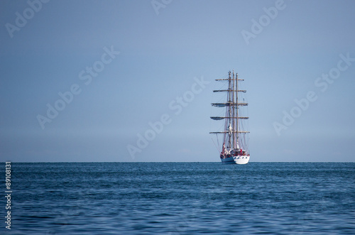 ship departs from a port in the sea.