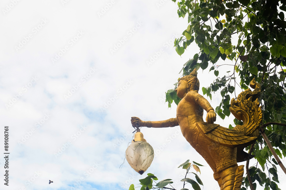 Golden Angel statue with morning sky Golden Angel statue with morning sky