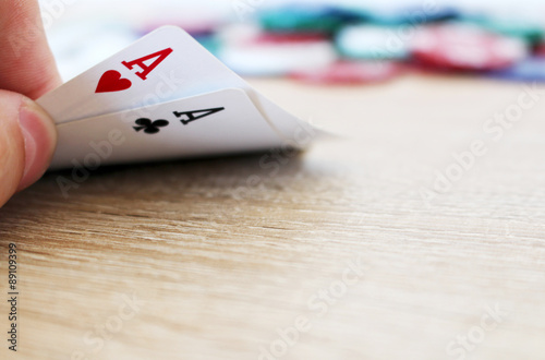 Poker hand with two aces and chips