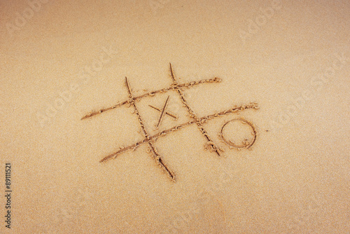 Figures in the sand on the beach.