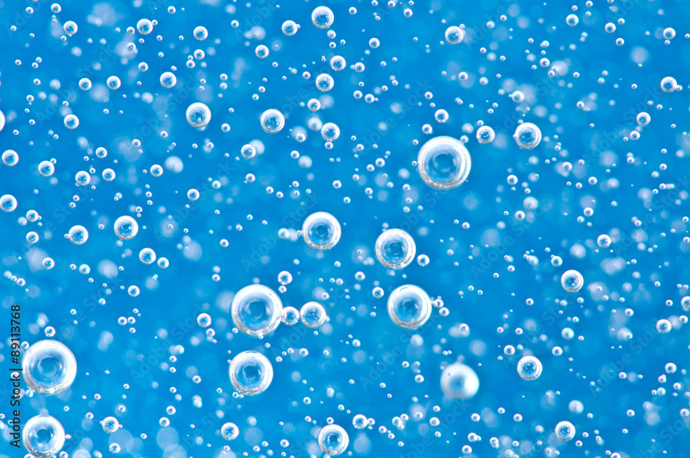 Macro Oxygen bubbles in blue clear water