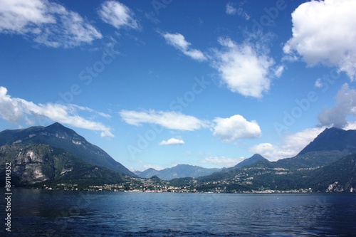 Lake Como view towards Menaggio under blue sky in Lombardy Italy 