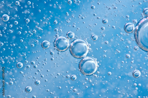 Macro Oxygen bubbles in blue clear water