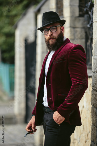 rich man with a beard, thinking about business © teksomolika