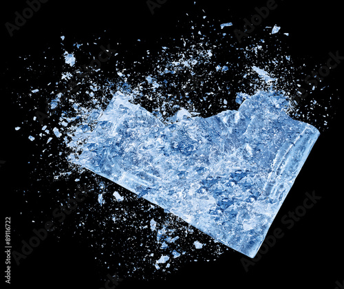 Abstract blue Ice crash explosion parts on black background. Collision, suspension crystal ice cubes damage.