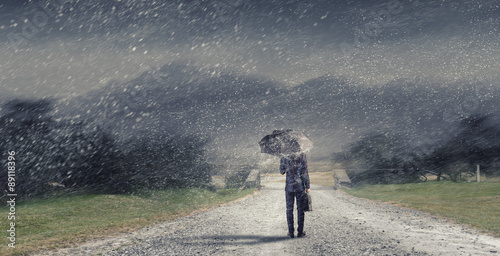 Tableau sur toile Man with black umbrella