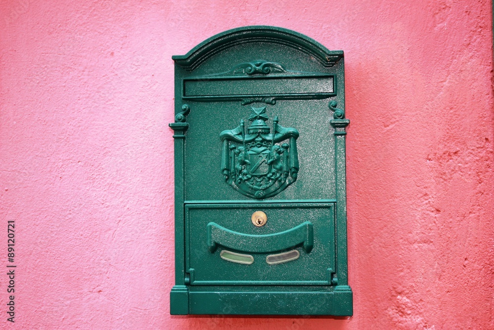  Mailbox green on red house wall