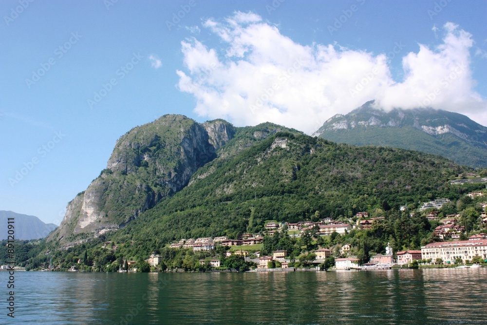 Menaggio lakefront on the shores of Lake Como under blue sky in Lombardy Italy 
