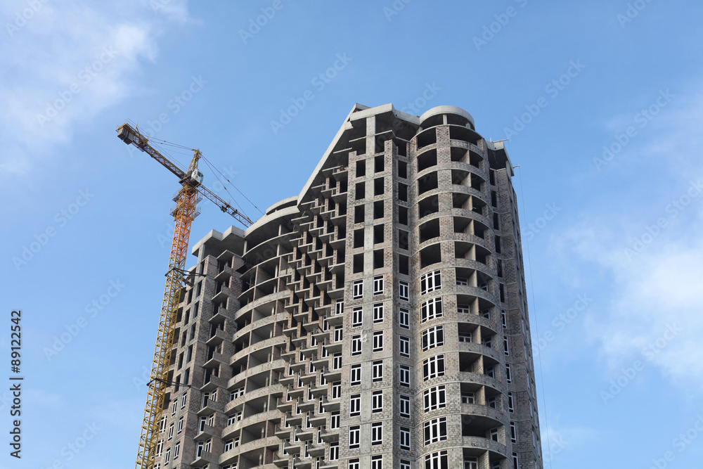 Crane and building house under blue sky Crane and building house under blue sky