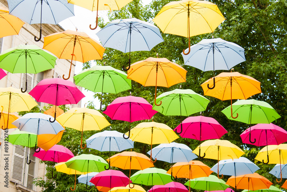 Obraz premium colorful umbrellas hanging in the air