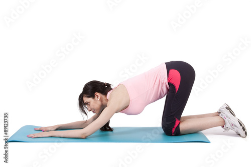 girl on mat doing back exercises