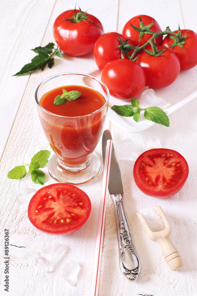 Bunch of tomatoes and tomato juice Bunch of tomatoes and tomato juice
