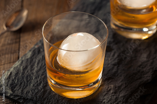 Fototapeta Naklejka Na Ścianę i Meble -  Bourbon Whiskey with a Sphere Ice Cube