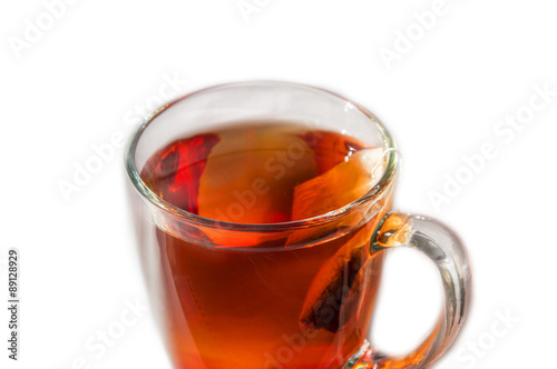 Teabag and tea in a cup