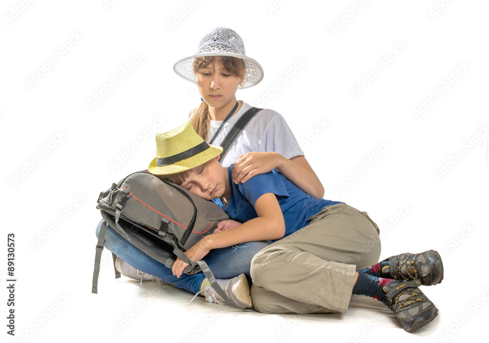 Young tourists boy and girl on a white Young tourists boy and girl on a white