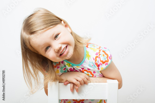 Funny smiling little girl.