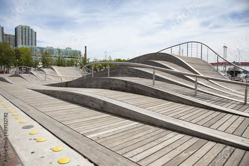 Fotografie, Obraz TORONTO - AUGUST 8, 2015: The Toronto Waterfront Wavedecks are a series of wooden structures constructed on the waterfront of Toronto, Canada as part of the revitalization of the central waterfront