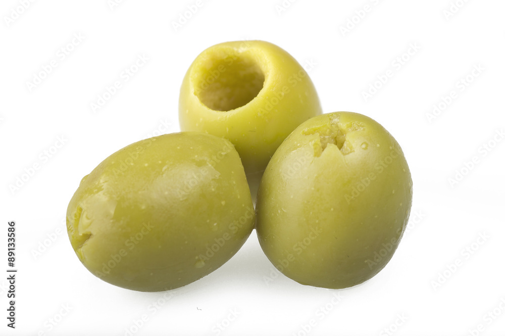 Obraz premium Pitted green olives close up on the white