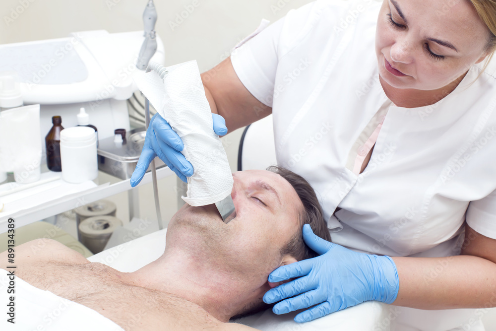 man in a beauty salon facial and massage man in a beauty salon facial and massage