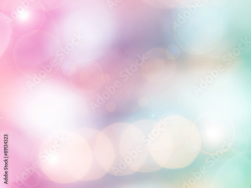 Abstract photo of backlight reflector and glitter bokeh lights background. Image is blurred and made with colorful filters.