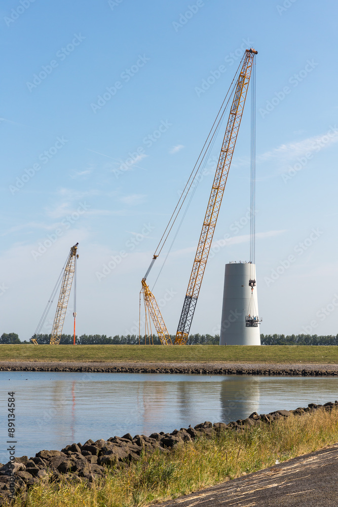 Big crane busy with construction of a new Dutch windturbine Big crane busy with construction of a new Dutch windturbine