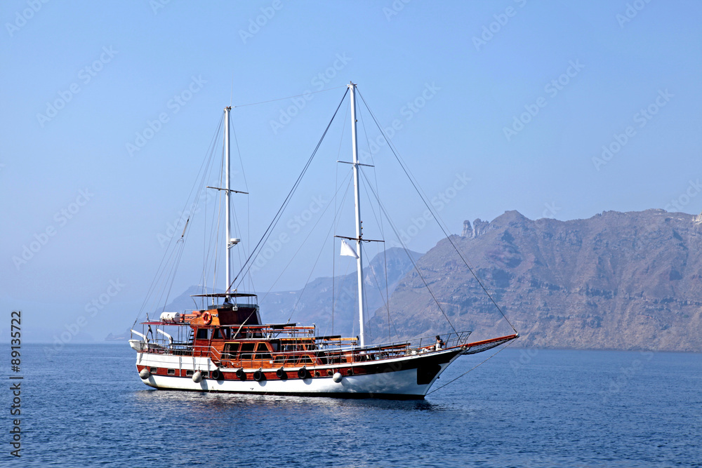 Old classic wooden sailboat in Santorini island, Greece