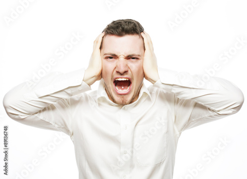 young office worker mad by stress screaming 