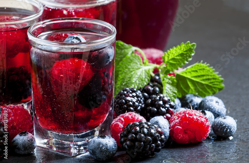 Fresh berry drink with blueberries, blackberries and raspberries