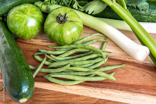 Cuadro en lienzo Fresh green vegetables on wooden background.